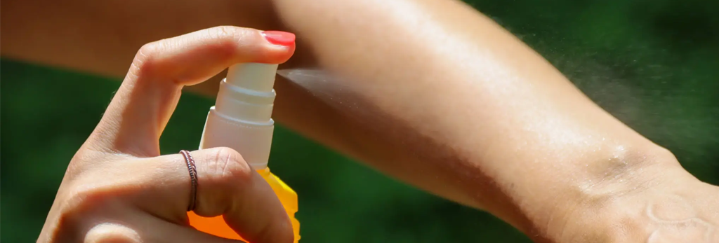 applying mosquito repelent